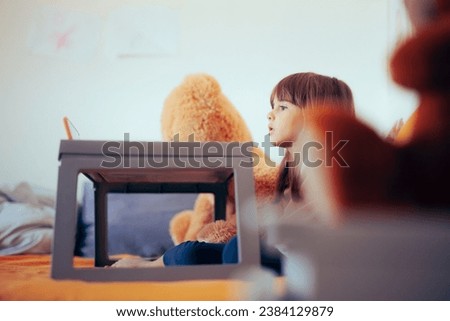 
Little Girl Watching Cartoons in Bed Feeling Sick. Neglected toddler looking at the screen for hours with no babysitting
 Royalty-Free Stock Photo #2384129879