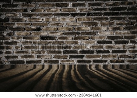 Dark color on old grunge brick wall texture or background and dark old wooden floor, in Brazil