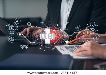 Businesspeople typing on laptop at office workplace. Concept of team work, business education, internet surfing, brainstorm, project information technology. Hands shot. Medical healthcare hologram Royalty-Free Stock Photo #2384161571