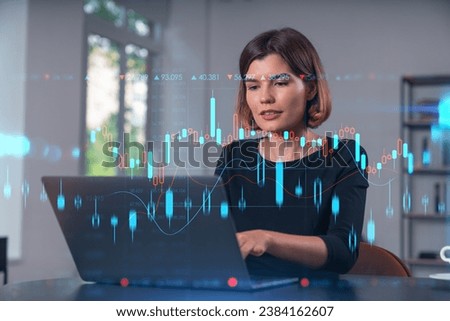 Pensive attractive beautiful businesswoman in formal wear working on laptop at office workplace in background. Forex graph and charts hologram icons. Concept of market trading and research.