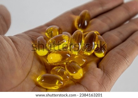 supplement capsules to maintain and care for the health of body organs including skin and internal organs Royalty-Free Stock Photo #2384163201