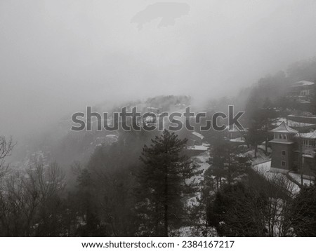 Following a fresh snowfall, the mountains of Murree, Pakistan, transform into a breathtaking, otherworldly landscape. The picture captures a mesmerizing view of these snow-clad peaks.