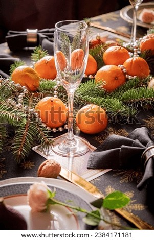 Christmas table with fresh mandarins