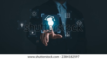 concept of modern education technology learning curriculum. Male hand touching light bulb icon Show access to website to learn the educational curriculum for skills development with virtual screen. Royalty-Free Stock Photo #2384182597