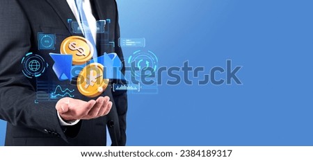 Businessman hand holding dollar and yen or yuan cartoon coins with arrow, glowing graph chart hologram with icons and lines on empty background. Concept of conversion and transaction