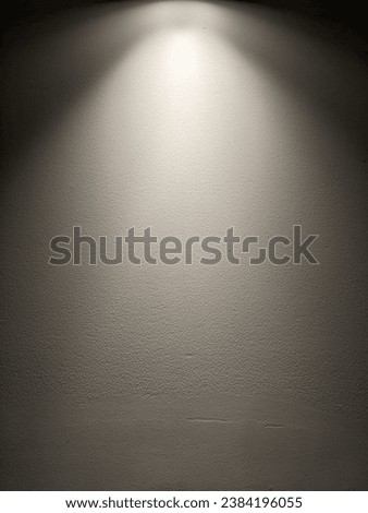 Photo of dark wall illuminated by light