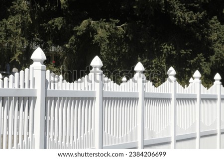 picket fence imagery. Whether it's fall foliage framing a charming picket fence or a rustic setting, these photos encapsulate the coziness of the season. Royalty-Free Stock Photo #2384206699