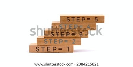 Step 1 to 5 written on wooden blocks. Isolated on white background.