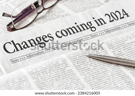 A newspaper with the headline Changes coming in 2024 Royalty-Free Stock Photo #2384216005
