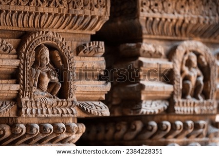 Carved wood wall decoration in Patan Durbar Square royal medieval palace and UNESCO World Heritage Site. Lalitpur, Nepal. Royalty-Free Stock Photo #2384228351