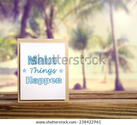 Make things happen motivational message card on tropical beach background