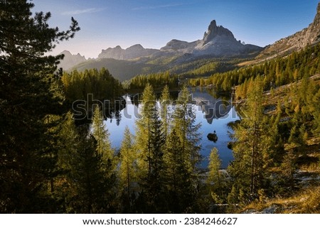 Amazing sunrise on Lago di Federa. Autumn landscape in the morning in the Italian Dolomites with a view of the Croda do Lago peak. Royalty-Free Stock Photo #2384246627