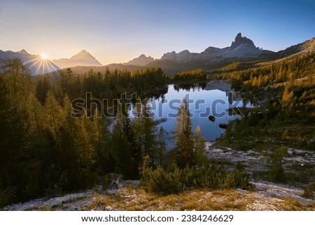 Amazing sunrise on Lago di Federa. Autumn landscape in the morning in the Italian Dolomites with a view of the Croda do Lago peak. Royalty-Free Stock Photo #2384246629