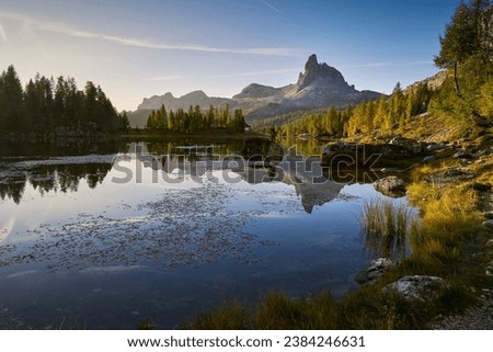 Amazing sunrise on Lago di Federa. Autumn landscape in the morning in the Italian Dolomites with a view of the Croda do Lago peak. Royalty-Free Stock Photo #2384246631