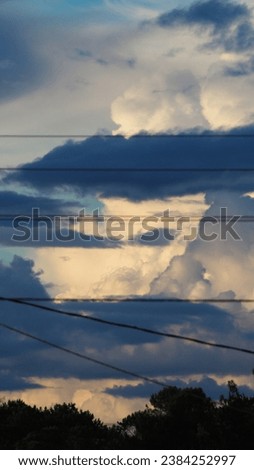 Stormy weather, with big cumulus an cumulonimbus clouds, during wunter season