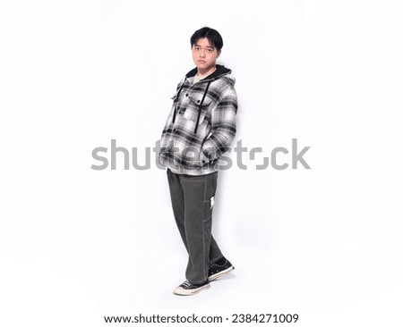 Asian full body young  student, man posing on white background 