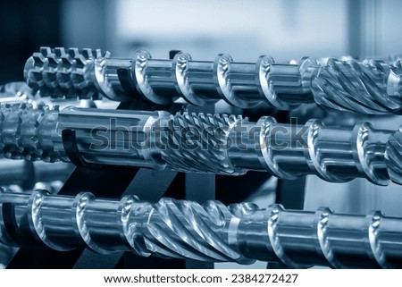 Close up scene  group of the barrel screw of injection machine spare parts. The manufacturing concept injection machine . Royalty-Free Stock Photo #2384272427