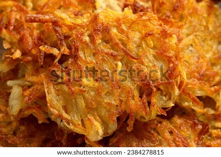 Potato rosti or hash brown close up, background Royalty-Free Stock Photo #2384278815