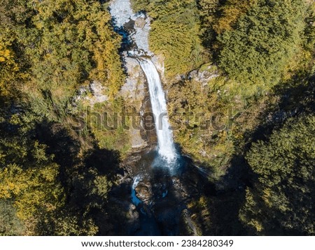 A huge beautiful waterfall in the forest.