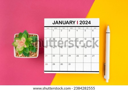 White calendar for January 2024 and pen on beautiful background, planning concept. Royalty-Free Stock Photo #2384282555