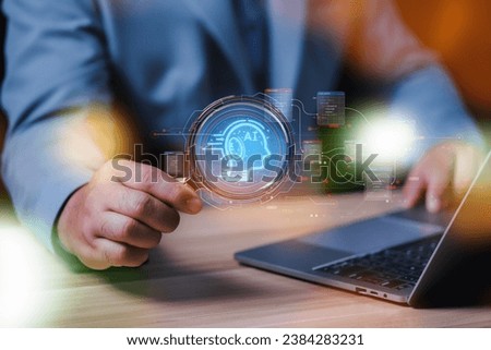 businessman uses magnifying glass and a laptop to connect artificial intelligence to search for information, Chatbot with AI, use command prompt for generates idea something or solve problems.