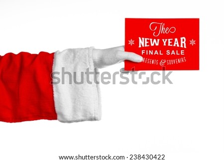Christmas and New Year discounts topic: Santa's hand holding a red card with a Christmas discount on an isolated white background