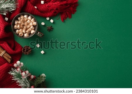 Welcome winter's charm: A top-view vertical picture of a lavish cocoa cup, marshmallow, spices, pine cone, mistletoe berries, and a crimson scarf on a green surface with space for text or advert