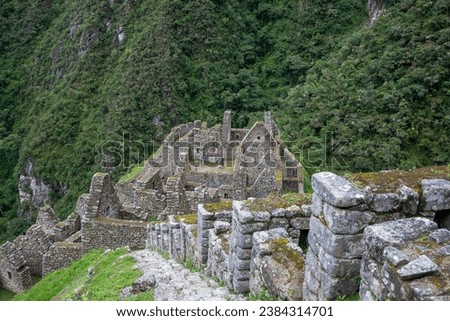 Wiñay Wayna is situated on the Inca Trail, which is the famous hiking route that leads to Machu Picchu. It is located approximately 4 kilometers (2.5 miles) from Machu Picchu. Royalty-Free Stock Photo #2384314701
