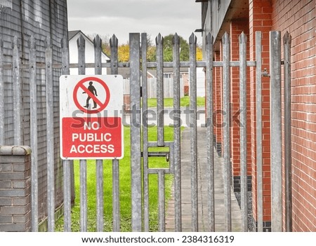 No public access sign on entrance gate to factory