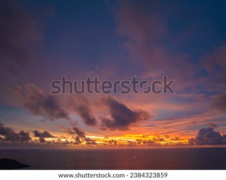 
Majestic sunset or sunrise landscape Amazing light of nature amazing cloud scape sky and colorful clouds moving away rolling. 
colorful yellow sunset clouds above the islands.