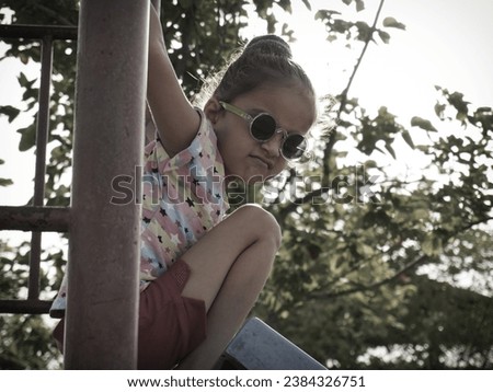 AI portrait photo with best editing filter effect on raw file.Cute little girl playing in garden on swinging.