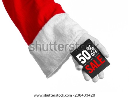 Christmas and New Year discounts topic: Santa's hand holding a black card with a 50 percent discount on an isolated white background