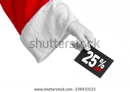 Christmas and New Year discounts topic: Santa's hand holding a black card with a 25 percent discount on an isolated white background