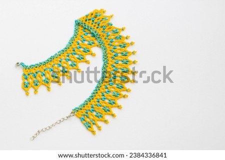 Beaded neck ornament, traditional ethnic silyanka, in yellow-blue colors