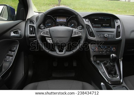 car dashboard and steering wheel, modern car interior design. Royalty-Free Stock Photo #238434712