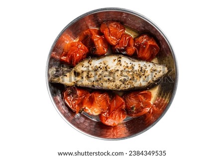 Fried halibut fish steaks with tomato in skillet. Isolated on white background