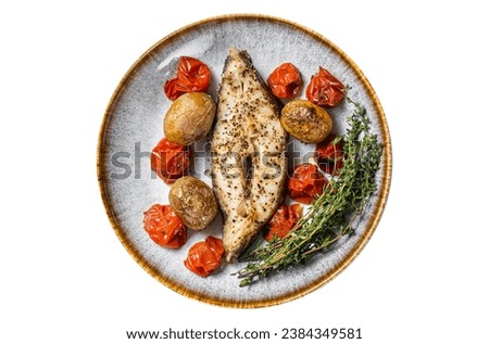 Grilled halibut fish steaks with tomato and potato in plate. Isolated on white background