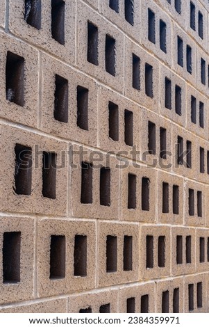 Air vents in a brown brick wall in a building on a Manhattan street