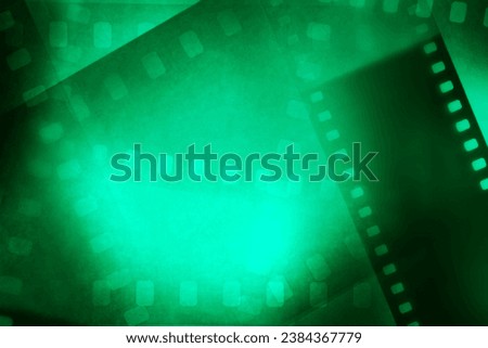 Film negatives frames green background
