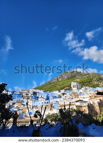 A picture taken from the garden of a restaurant, showing the beautiful blue pearl of Morocco, Chefchaouen 