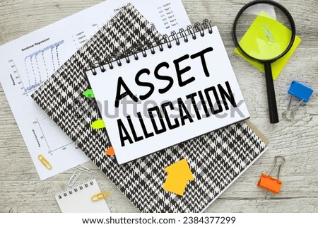 ASSET ALLOCATION notepad with text. notes in a notepad. magnifying glass