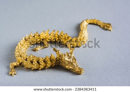 Golden metal dragon on gray background decor for Chinese New Year