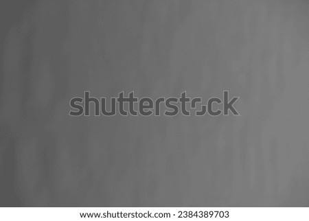 Blurred background in the form of a gray inhomogeneous surface