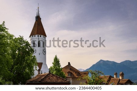 Beautiful view of the central church or Stadtkirche on a sunny day with blue sky. Thun, Canton of Bern. Switzerland travel and landmarks. A walk through the city