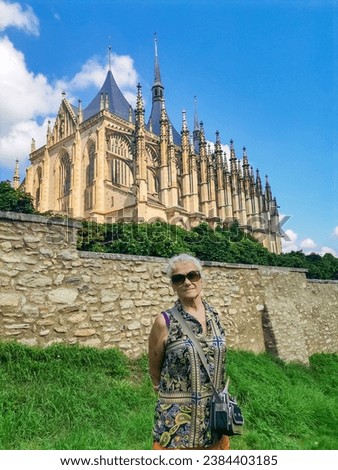 Senior woman on excursion in St Barbara Church Kutna Hora, Czech Royalty-Free Stock Photo #2384403185