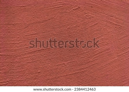 A red jagged wall with slightly convex lines. Blank for creative works, decorative design, wallpaper, screensavers. Royalty-Free Stock Photo #2384412463