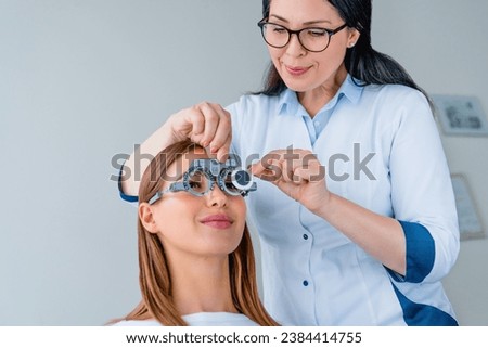 Ophthalmology concept. Patient examination eye vision in ophthalmological clinic. Eye sight vision problems. Lens measurement. Spectacles Royalty-Free Stock Photo #2384414755