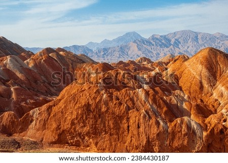 Colorful Danxia Topography during the golden hour, Zhangye, Gansu, China. Sunset picture with blue sky and copy space for text