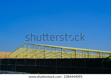 Industrial Photography. A roof frame of a factory under construction. Textile factory, iron frame, construction industry, factory construction, Bandung - Indonesia