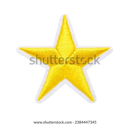 embroidered yellow star isolated on white background Royalty-Free Stock Photo #2384447345